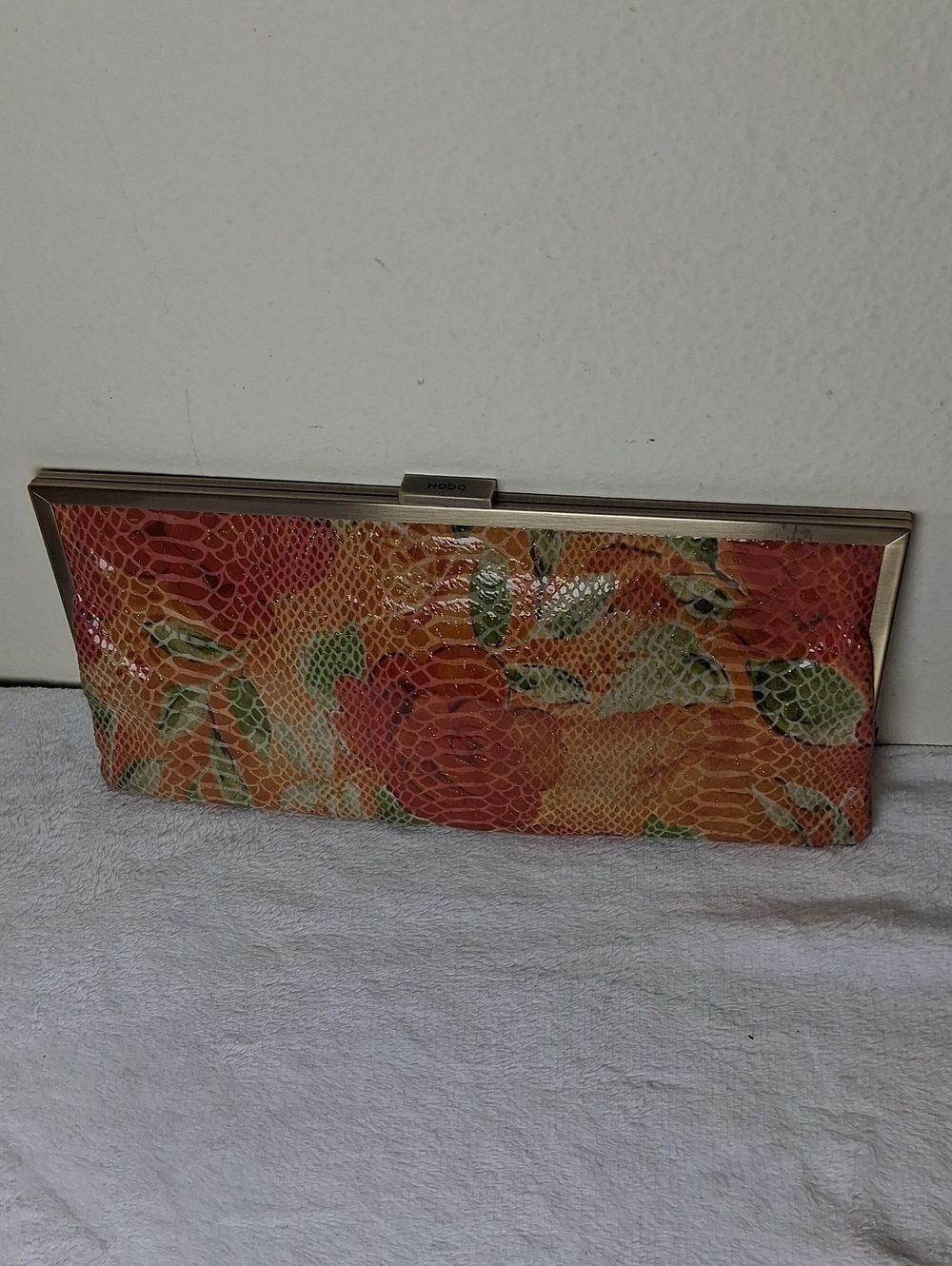 HOBO Orange Floral Snake-Embossed Frame Clutch